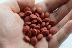hand full of ibuprofen pills